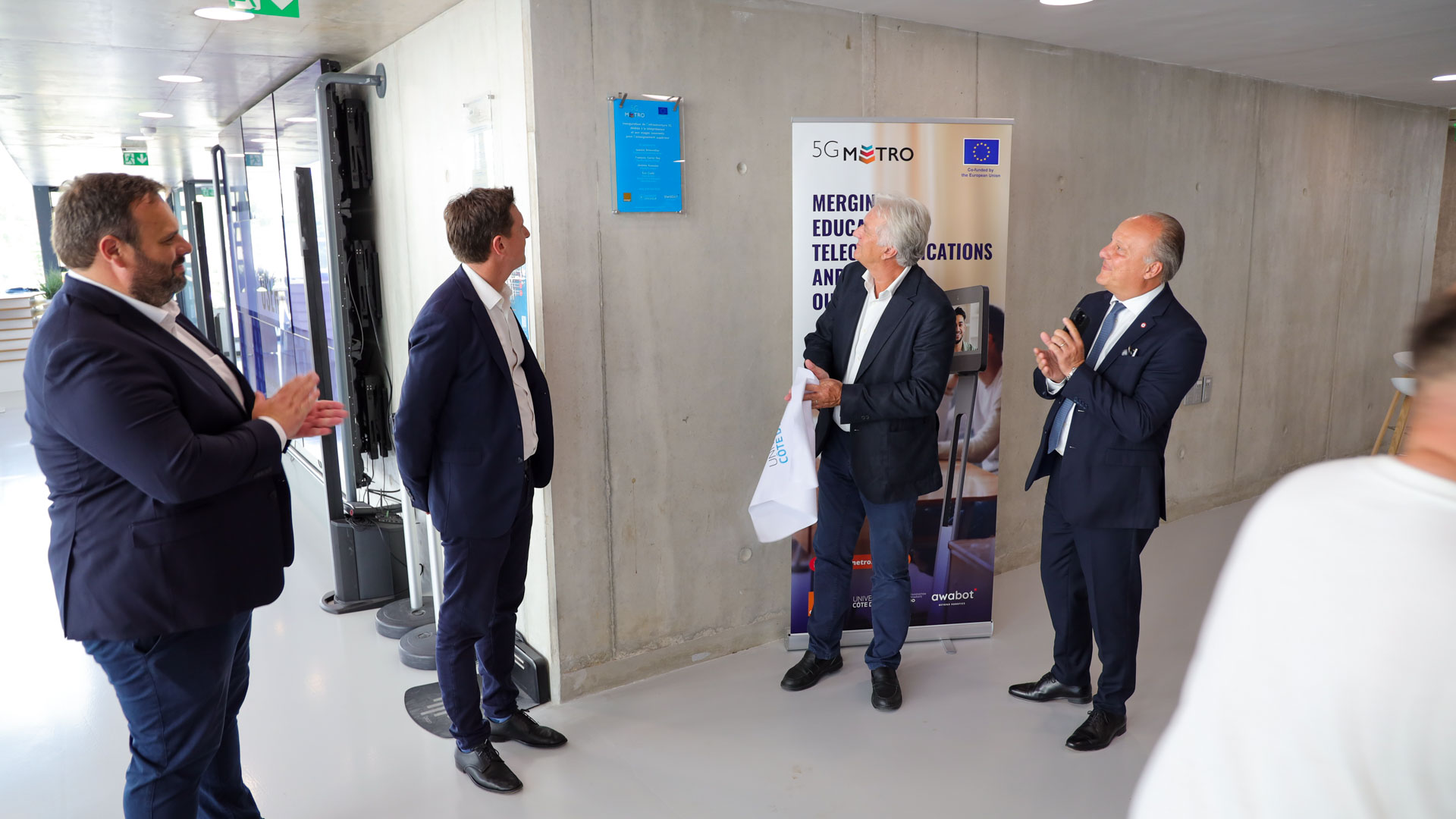 Photos from the inauguration of the 5G Metro hybrid private 5G network at IMREDD, featuring project partners, telepresence robots, demonstrations and discussions on inclusive education, innovation and advanced connectivity.